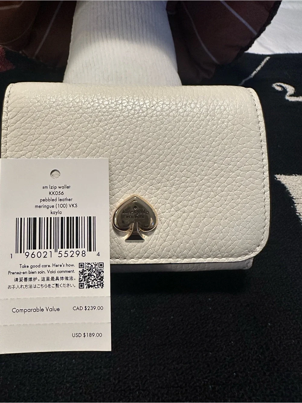kate spade cream pebbled leather small zip wallet with gold spade emblem